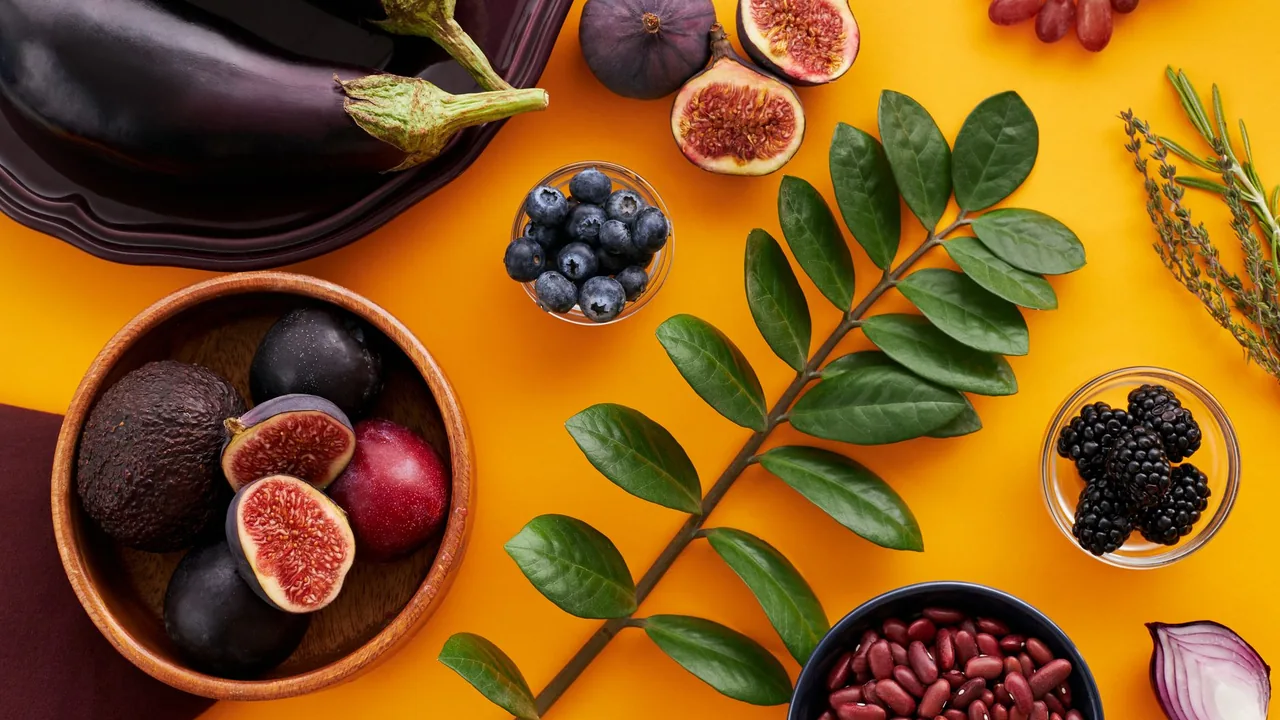 Fresh vegetables and fruit arranged on a bright surface representing healthy living.